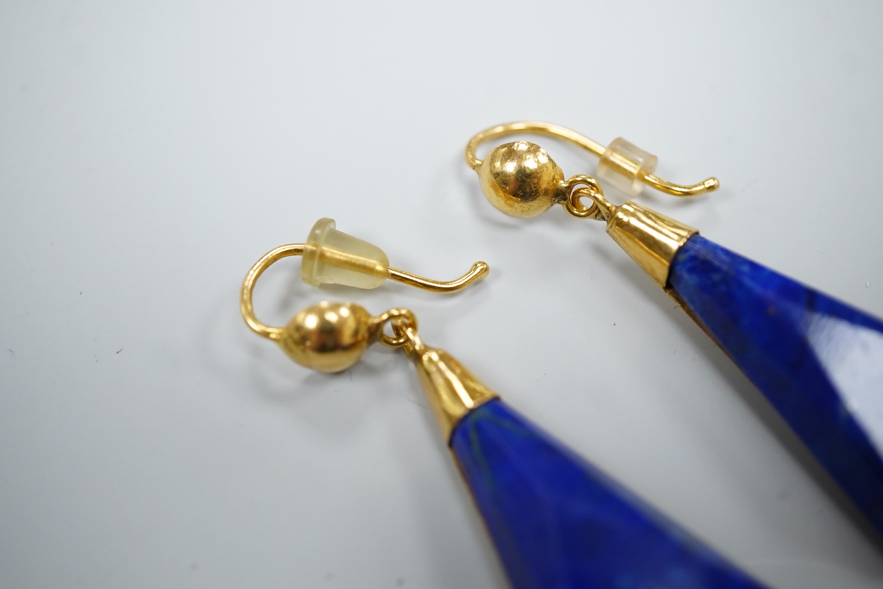 A pair of yellow metal and angular cut lapis lazuli set drop earrings, overall 42mm, gross weight 8.6 grams.